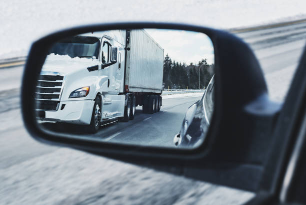 istock Semi Truck in Side Mirror 1209472852