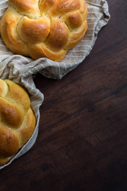istock Tasty bread on wooden table 1209474446