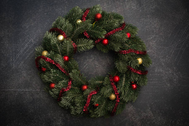istock Christmas wreath decoration dark-gray background 1209474452