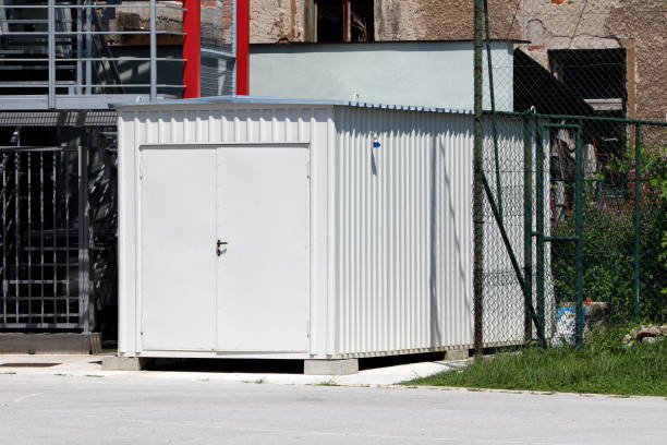 istock New shipping container converted into storage area with metal locked doors in front mounted on concrete foundation 1209479544