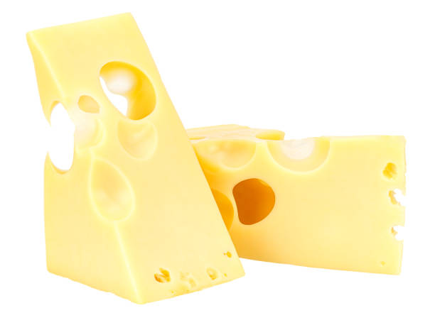 istock Standing and lying two triangular pieces of Maasdam cheese isolated on a white background 1209482712