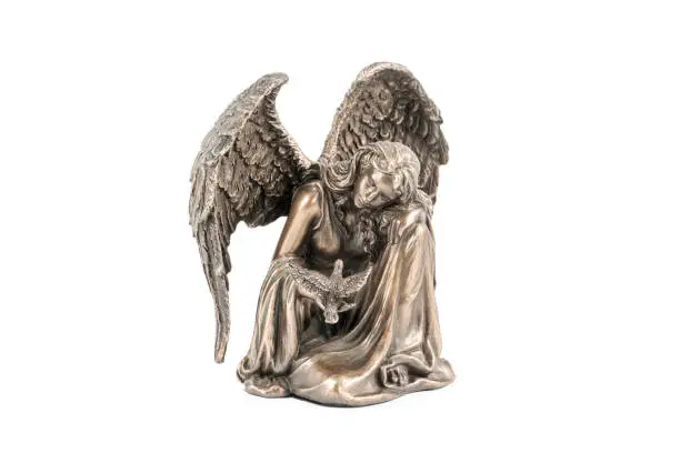 Photo of bronze statuette of an angel with bird