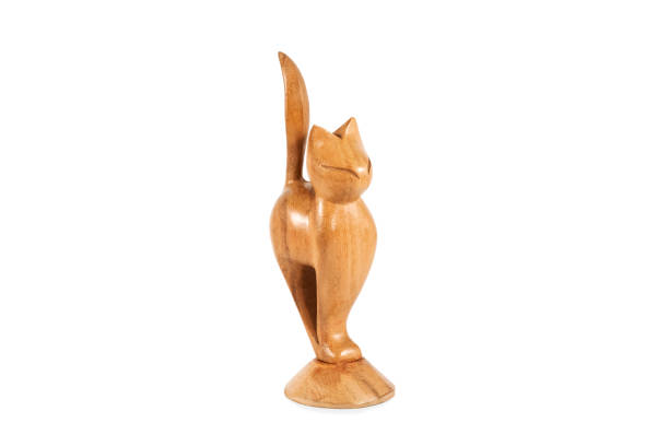 istock wooden cat figurine on white 1209483046