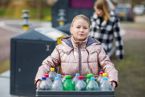 istock Family recycling plastic bottles 1209485860
