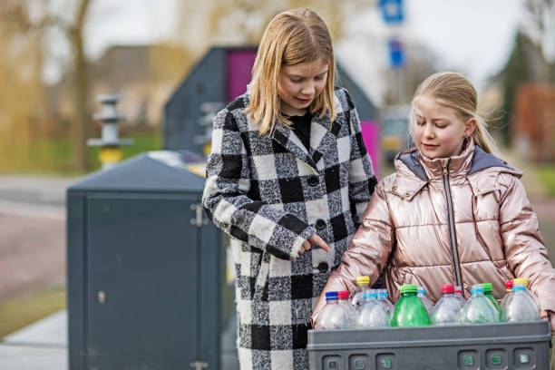 istock Family recycling plastic bottles 1209485862