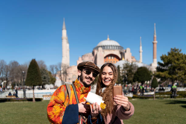 istock Young couple taking selfies in front of Hagia Sofia Istanbul 1209485890