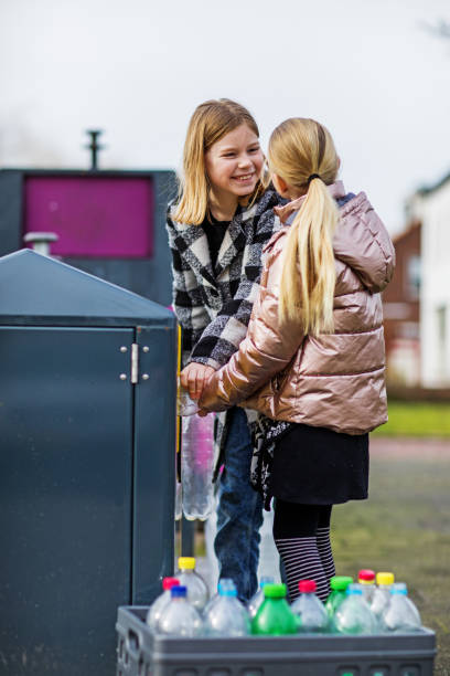 istock Family recycling plastic bottles 1209488160