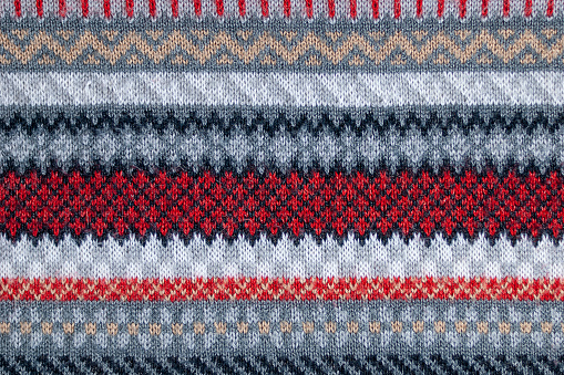 Sample of knitted multicolored ornaments and patterns
