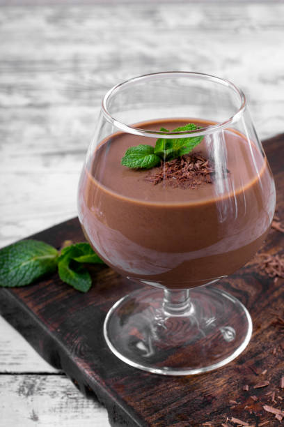 istock Chocolate pudding topped with mint in the glass 1209488796