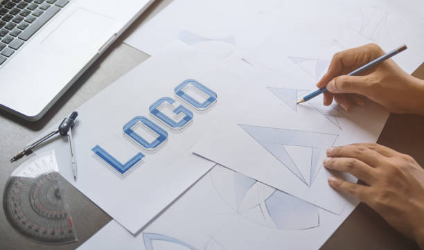 istock Graphic designer creative design sketch drawing logo Trademark brand Workspace 1209489902