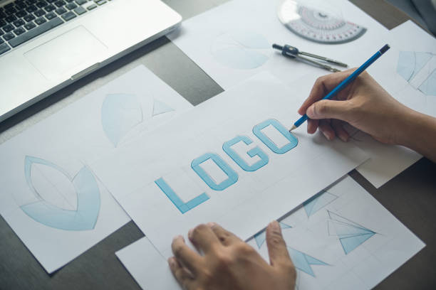 istock Graphic designer creative design sketch drawing logo Trademark brand Workspace 1209489903