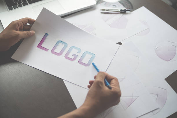 istock Graphic designer creative design sketch drawing logo Trademark brand Workspace 1209489904