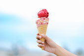 Mix berry and vanilla ice cream cone on hand