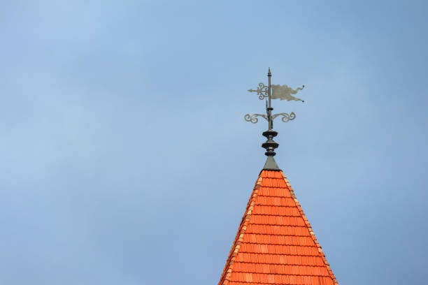 A tower that has a sign on the side of a building. High quality photo