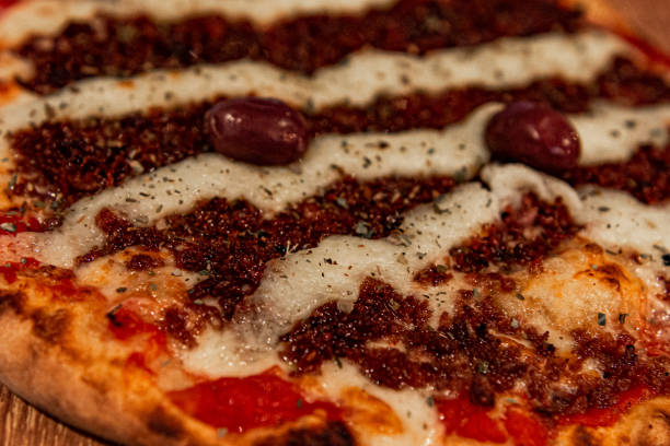 istock Ground pepperoni pizza with green olives and cream cheese 1209496552