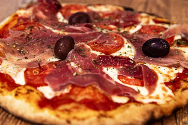 istock Buffalo mozzarella pizza with Parma ham 1209498572