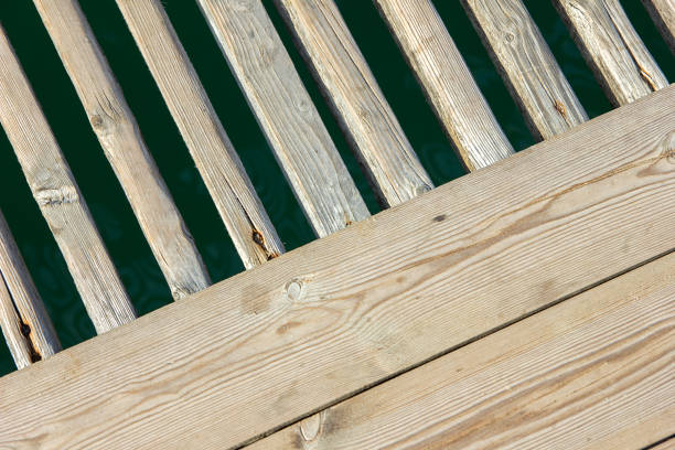Water surrounding a traditional wooden pier