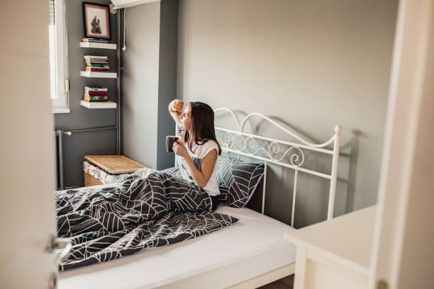 istock Young woman is waking up in the morning 1209501643