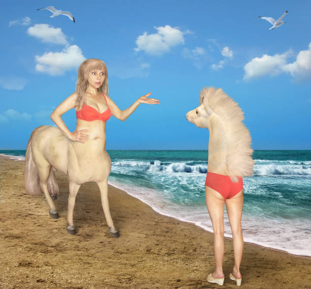 istock Female centaur meets strange horse 1209501644