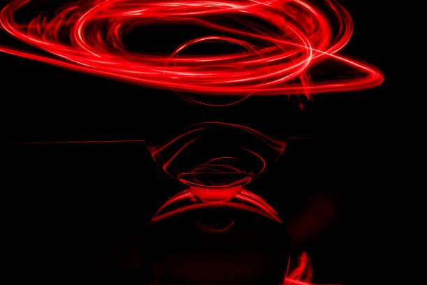 istock some red rings surround a crystal clear glass ball on a mirror 1209501725