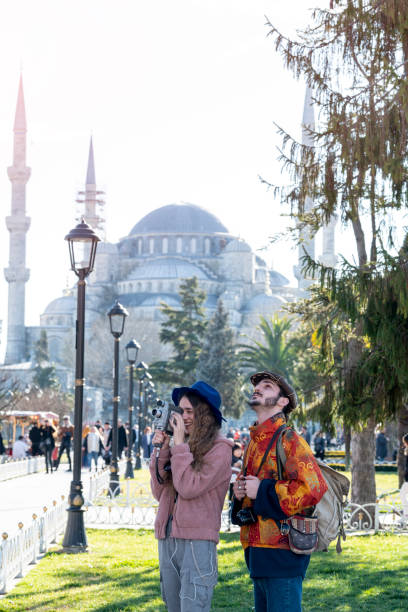 istock Tourists taking photos in front of blue mosque 1209502956