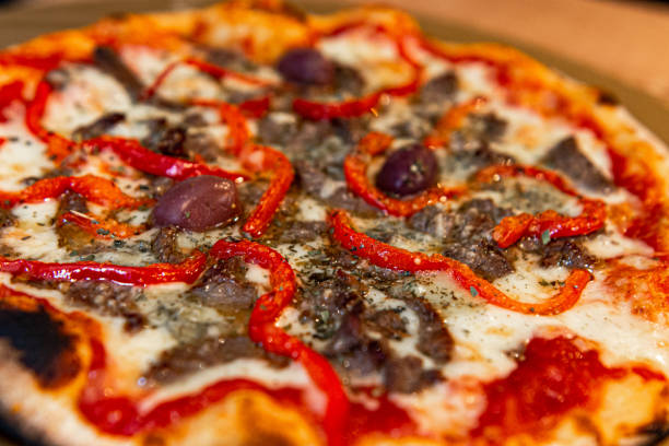istock Four cheese pizza with filet mignon 1209504016