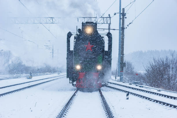 istock Retro steam train departs from the railway station. 1209505708
