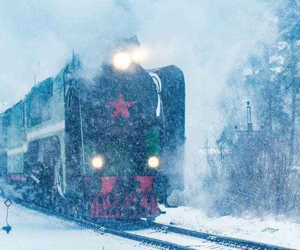 istock Retro steam train departs from the railway station. 1209505781