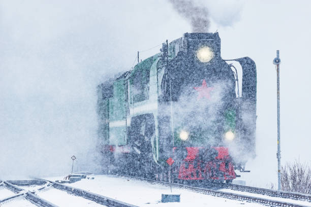 istock Retro steam train departs from the railway station. 1209505810