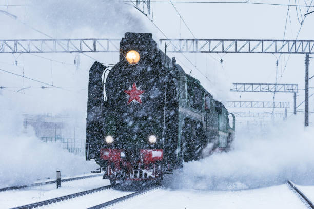 istock Retro steam train departs from the railway station. 1209505843