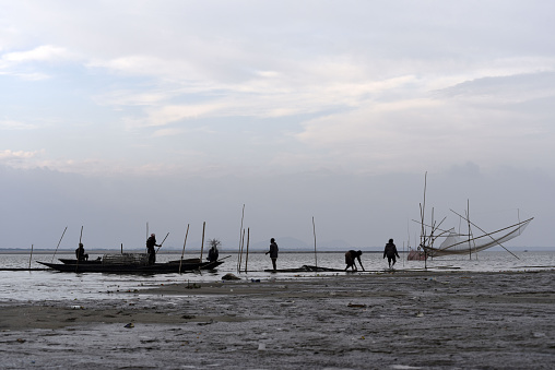 fisherman and a boat in Bang Pat village,Phang-Gna province, Thailand
