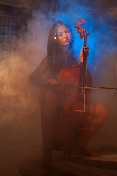 istock Cellist woman performing in Turkish bath 1209515828