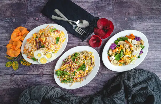 Here are 3 platters. Fried Rice with egg, Spicy noodles and Chinese salad.