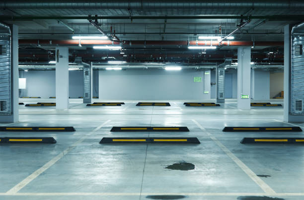 Horizontal image of empty underground parking lot stock photo