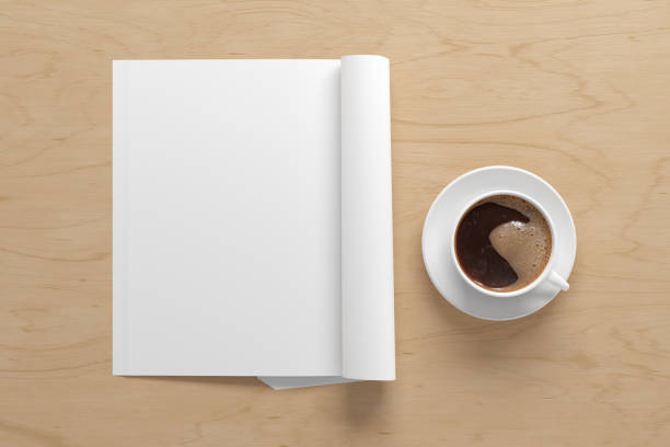 istock Blank magazine page. Workspace with folded magazine mock up on the desk. 1209517839