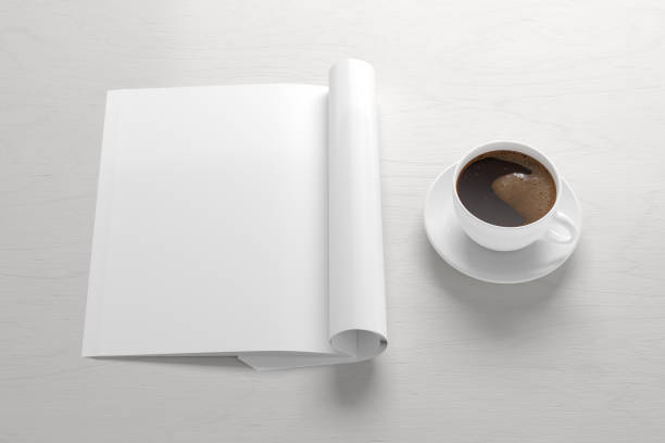 istock Blank magazine page. Workspace with folded magazine mock up on the desk. 1209517879