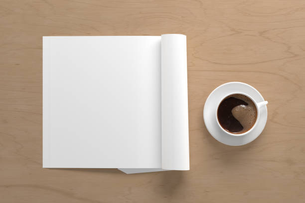 istock Blank magazine page. Workspace with folded magazine mock up on the desk. 1209517949