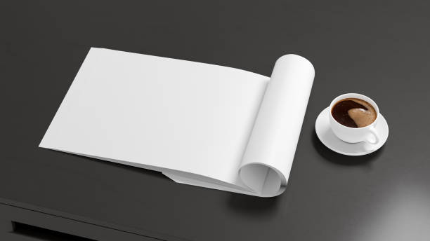 istock Blank magazine page. Workspace with folded magazine mock up on the desk. 1209518523