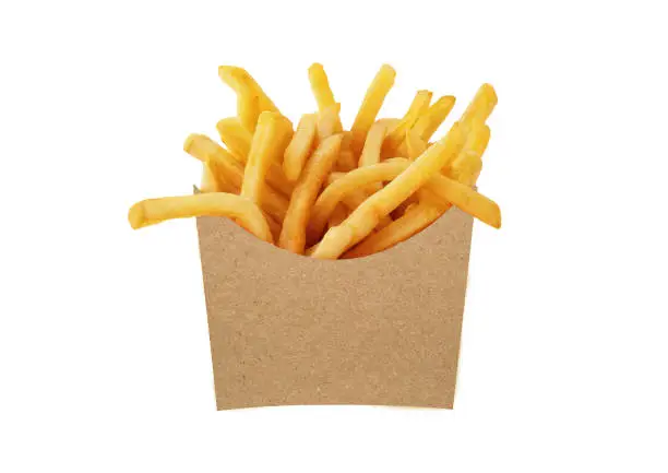 French fries in a brown kraft paper bag isolated on a white background