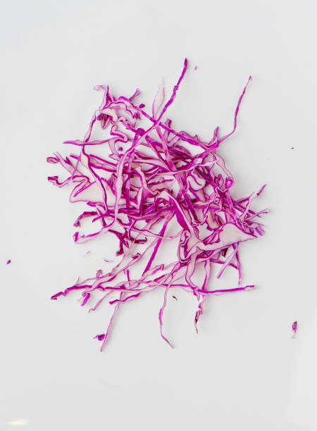 ingredient Red Cabbage, shredded and photographed on white background and overheard. Classic American, Vietnamese, Chinese, Thai, Japanese or Mexican restaurant staple ingredient. red cabbage stock pictures, royalty-free photos & images