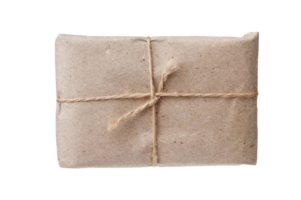 istock parcel wrapped with brown kraft paper isolated on white background 1209521084