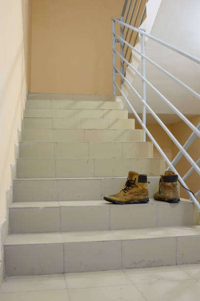 istock There are discarded boots on the stairs 1209522829