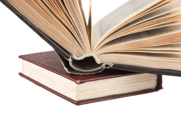 istock open old books  isolated on white background 1209523648