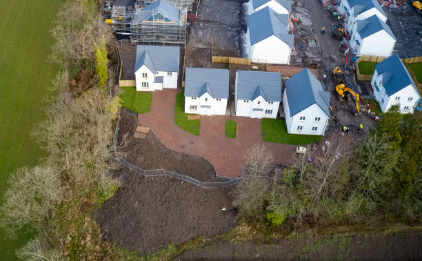istock New private housing development construction in rural countryside aerial view 1209525369