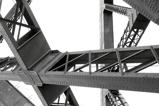 Closeup Harbour Bridge large complicated steel structure, white background with copy space, full frame horizontal composition