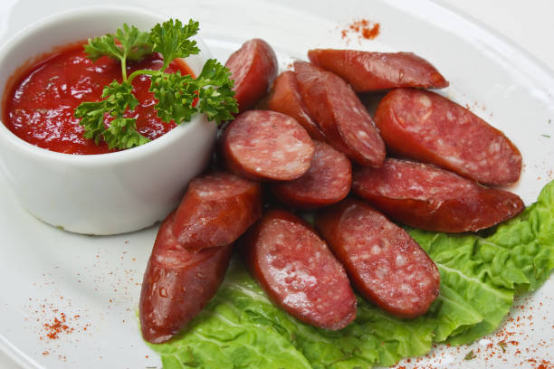 istock chopped sausages fried with vegetables and spices 1209525404
