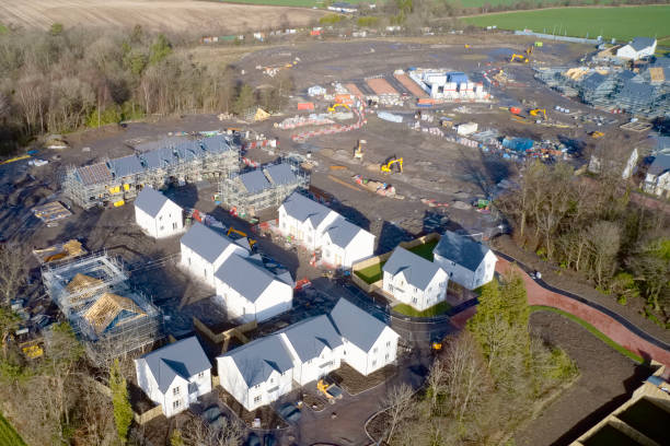 istock New private housing development construction in rural countryside aerial view 1209525497