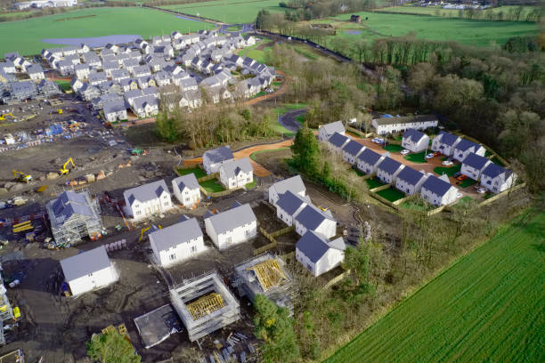 istock New private housing development construction in rural countryside aerial view 1209528110