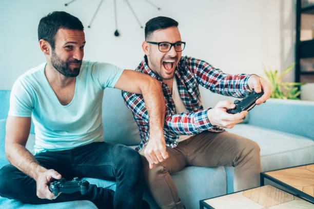 istock Excited friends playing video games 1209528167