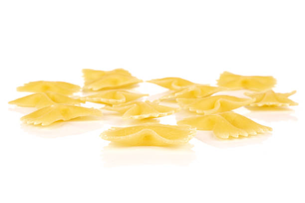 istock Yellow farfalle pasta isolated on white 1209528995
